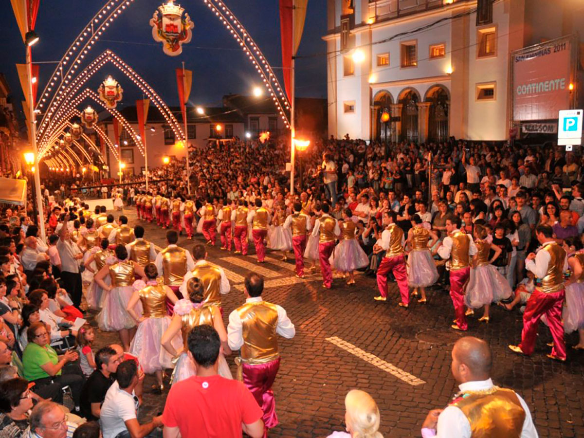 Locals in traditional attire during Sanjoaninas Festival in Angra.