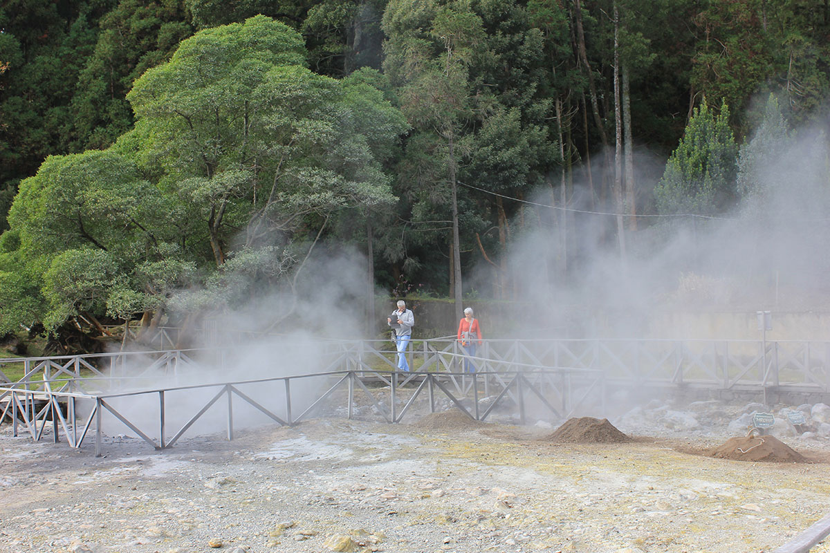 Steam rising from geothermal vents in Furnas Valley