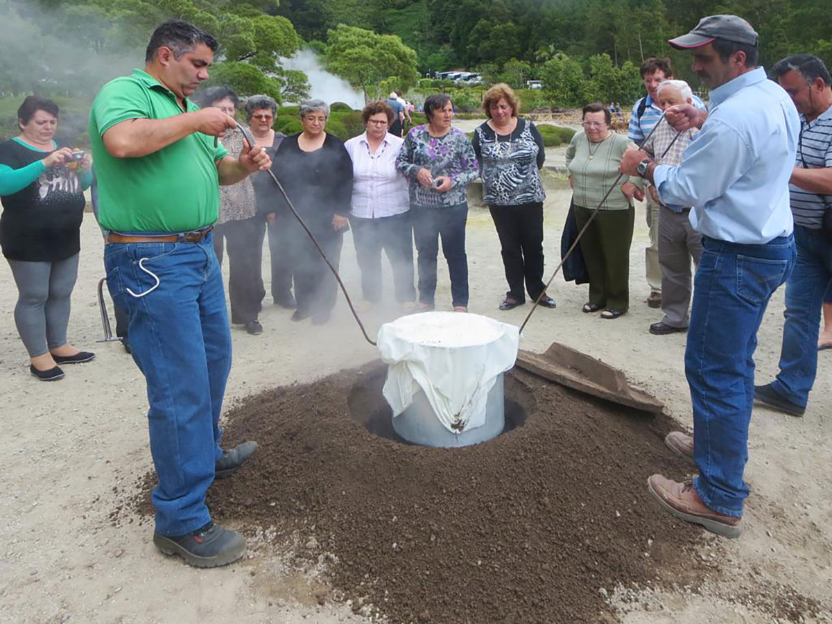 Traditional Cozido das Furnas being pulled from the volcanic soil