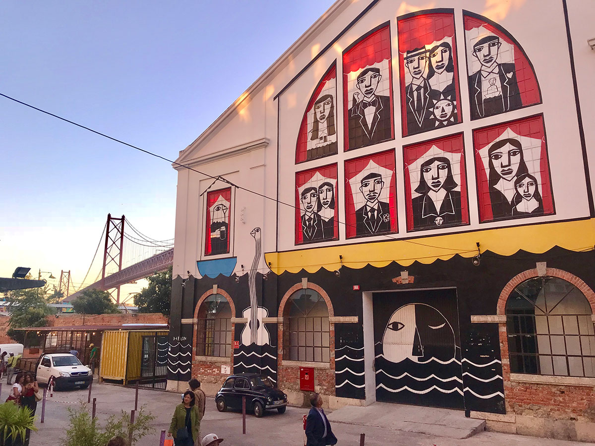 Street art mural on a building at LX Factory in Lisbon.