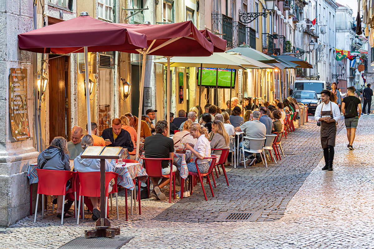 Crowds enjoying nightlife in Lisbon's Bairro Alto district.