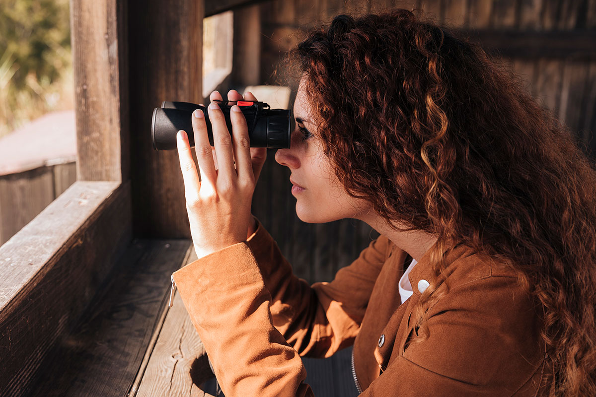 Group with binoculars watching birds during the Sagres Birdwatching Festival