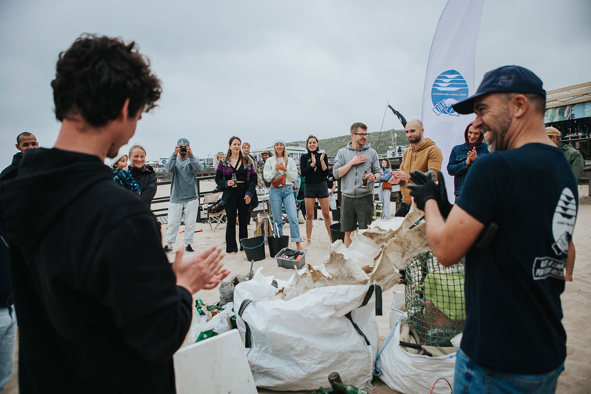 Volunteers participating in a beach cleanup effort in Ericeira