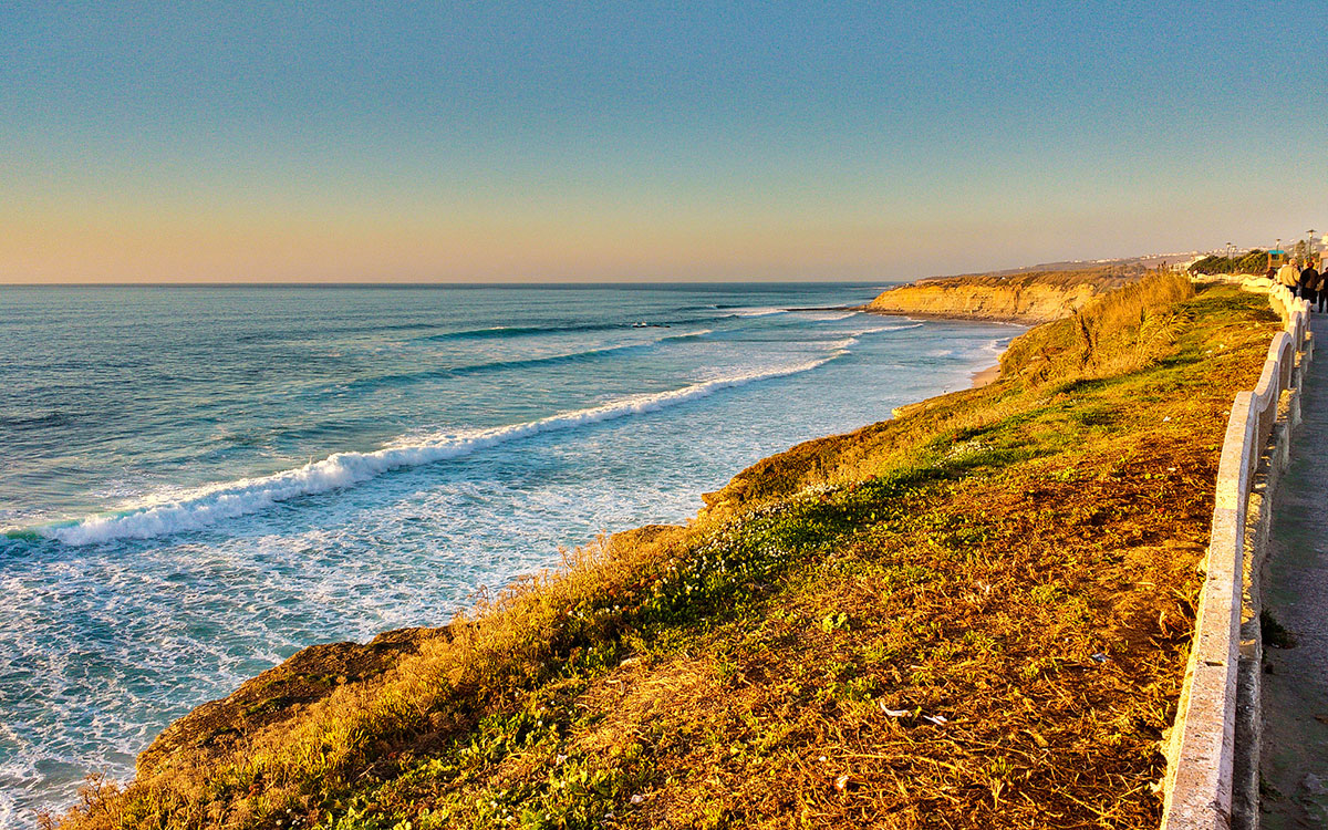 Scenic cliffside trail leading to Ribeira d’Ilhas beach in Ericeira