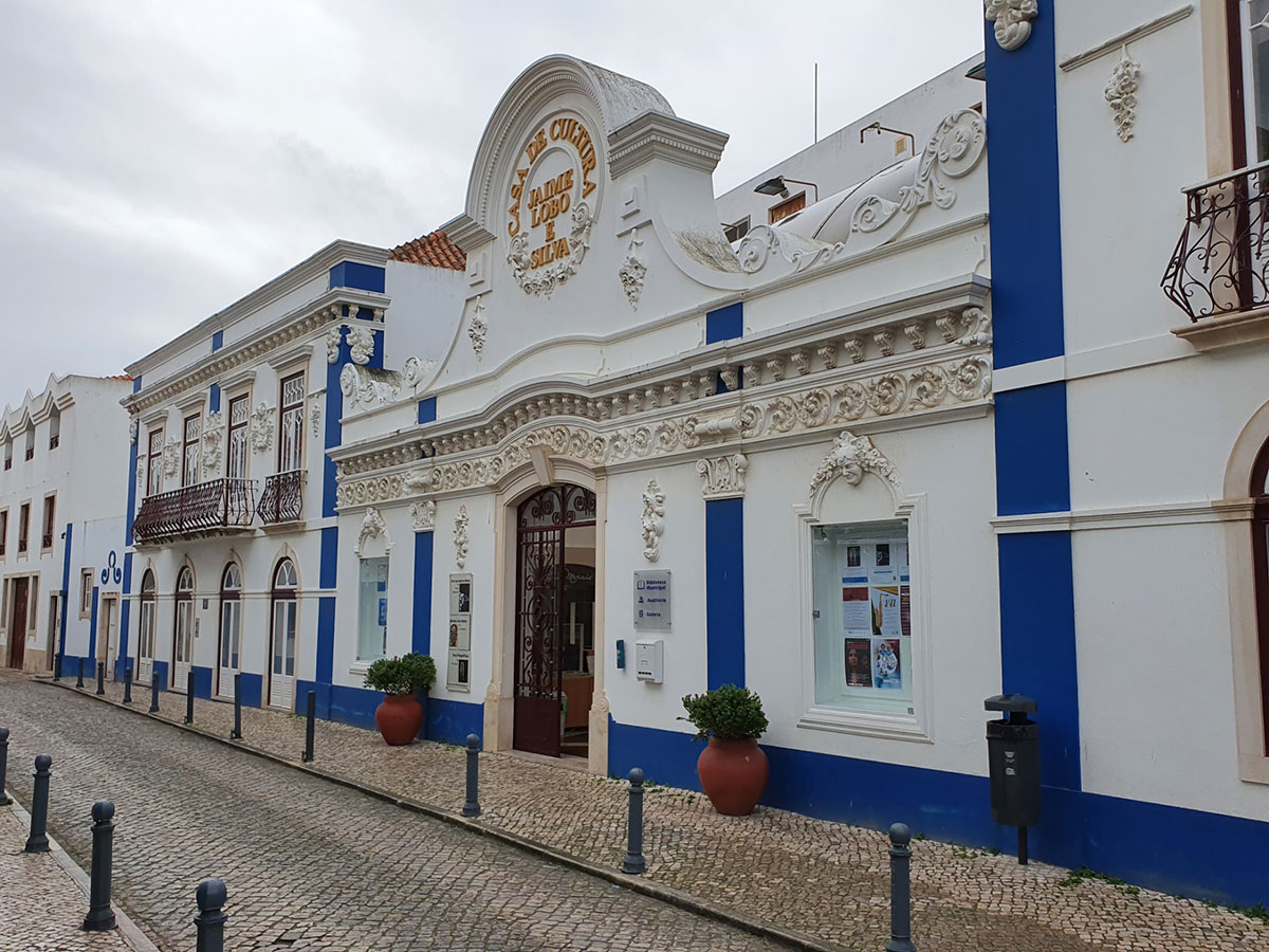 Facade of Casa de Cultura Jaime Lobo e Silva in Ericeira, showcasing neoclassical architecture with ornate detailing