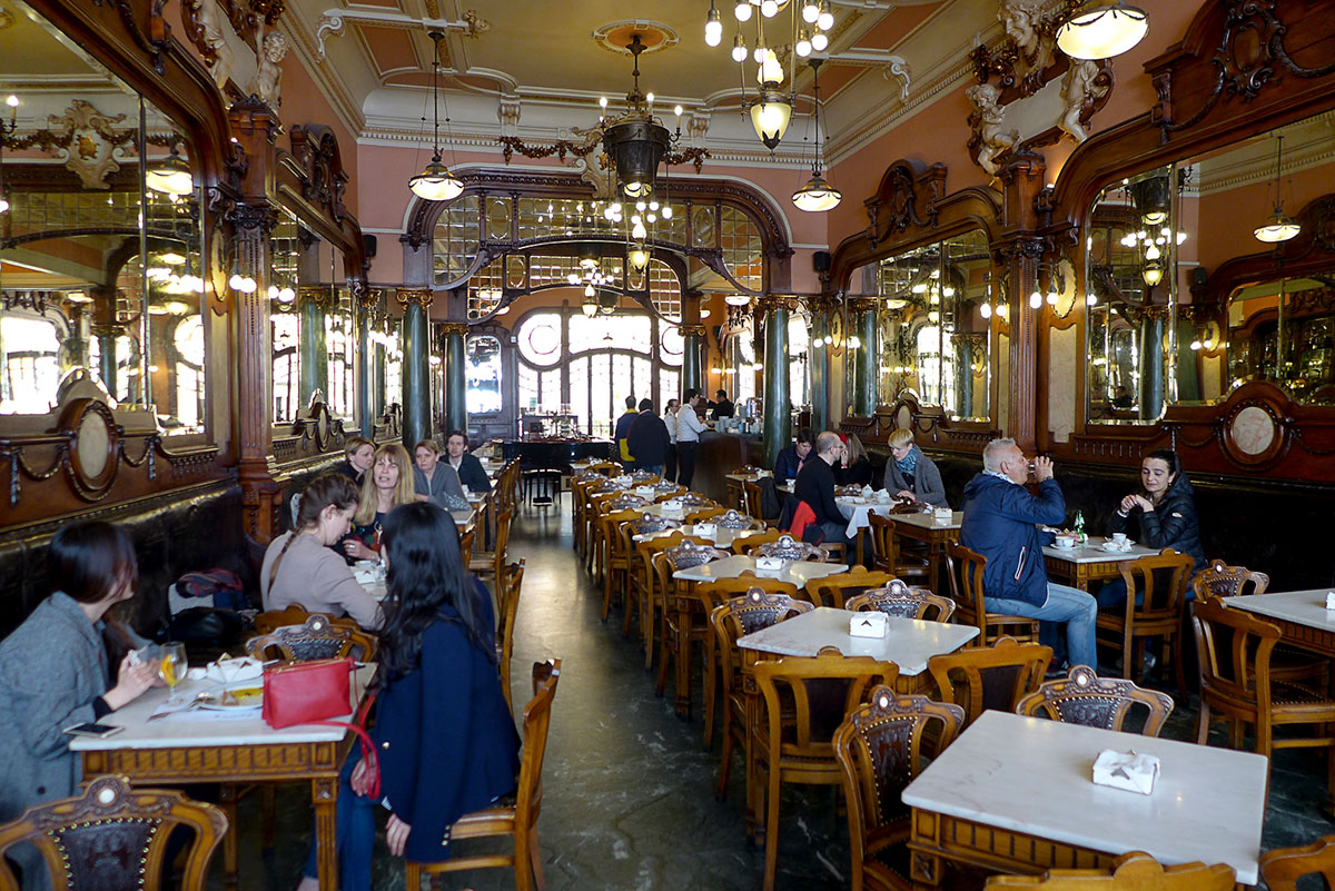 Ornate interior of Majestic Café with chandeliers and vintage décor