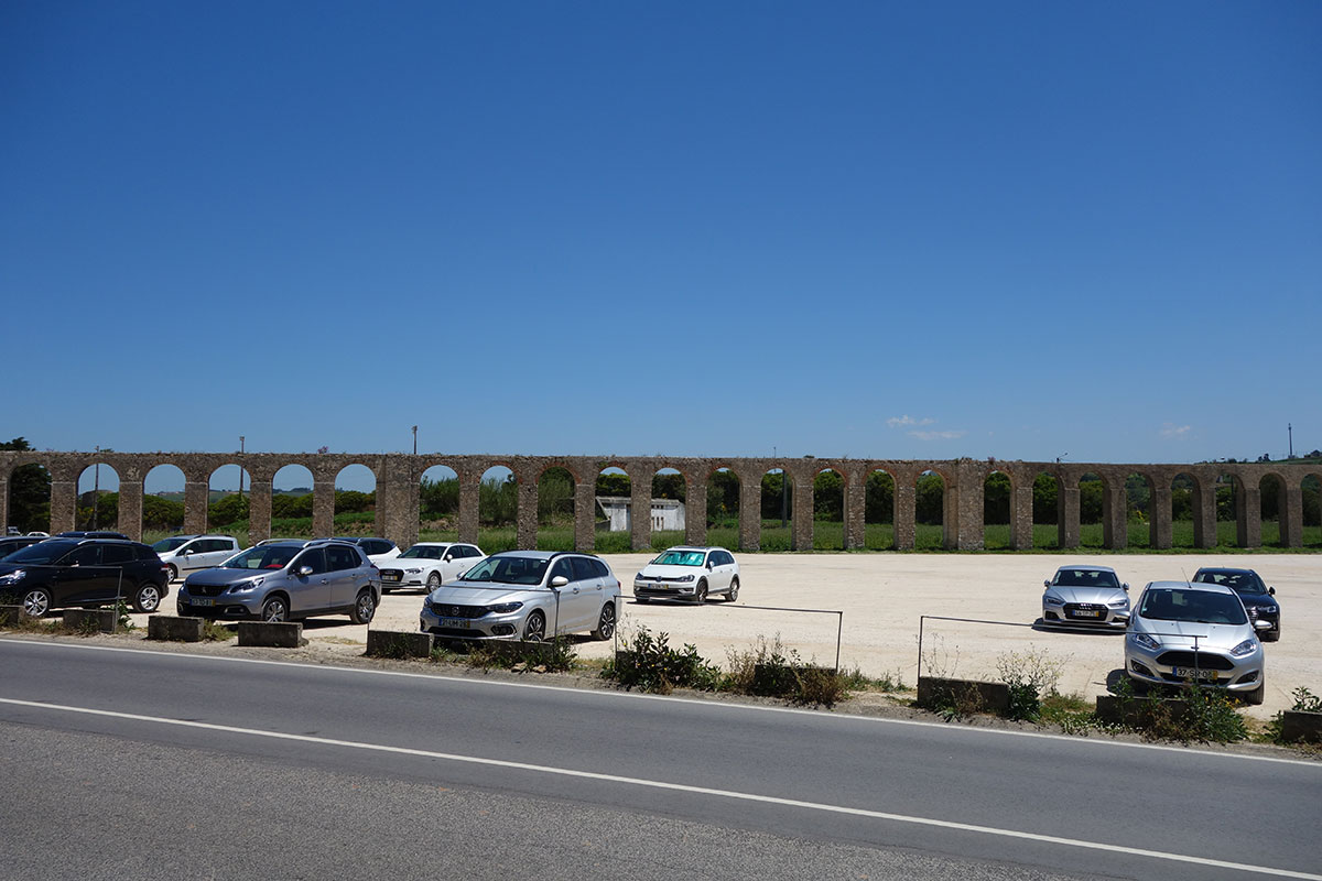 Designated parking area outside the walls of Óbidos for visitors.