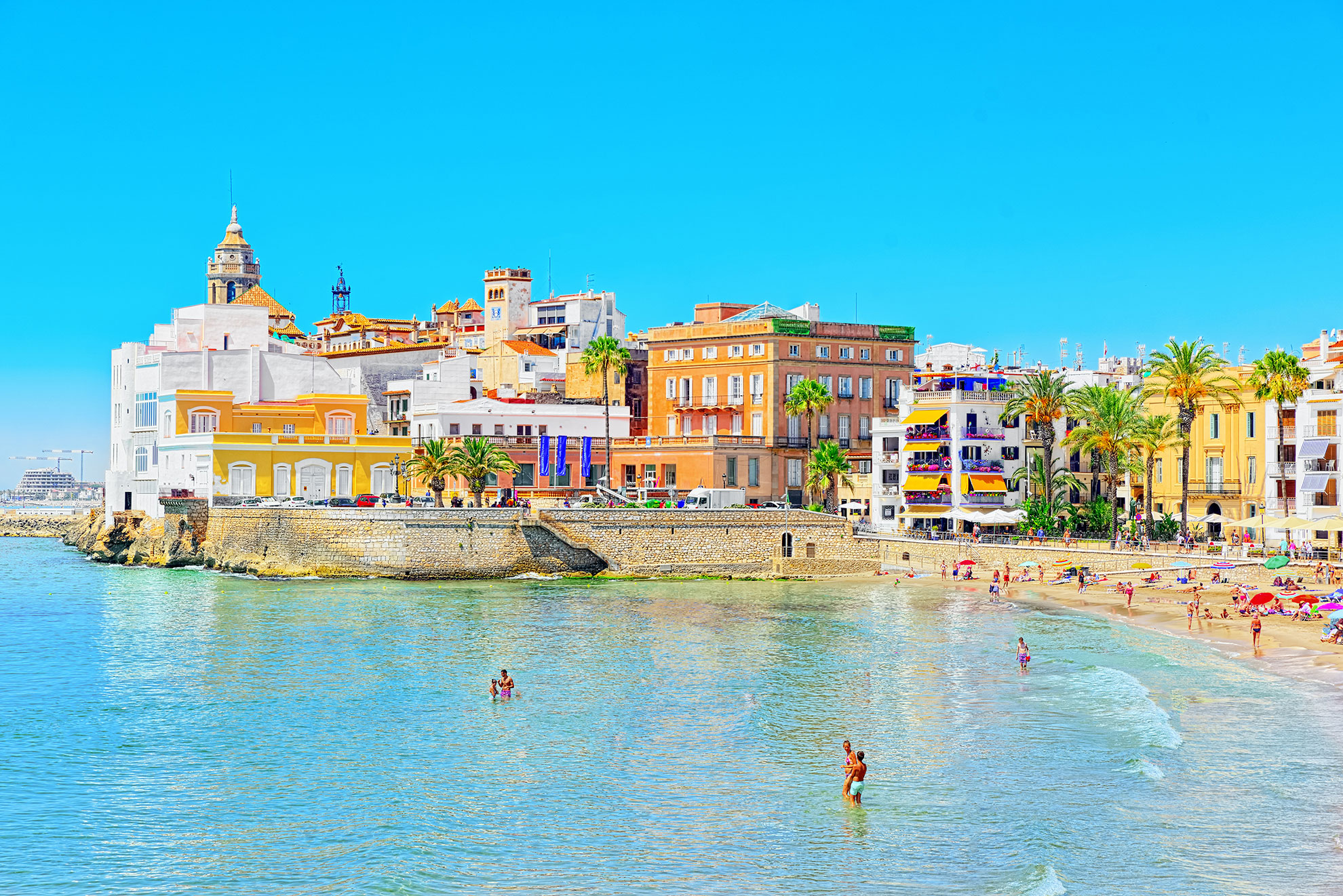 View of the beach and the sea shore of a small resort town Sitge