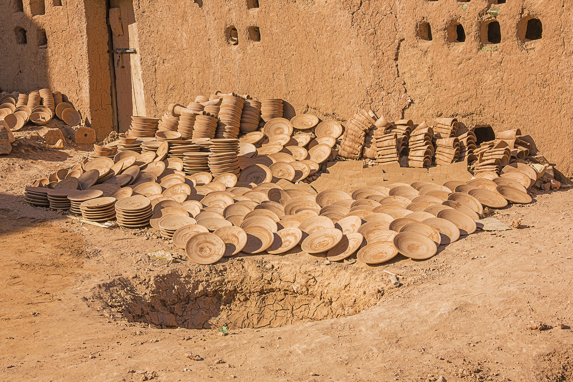 Plates and tiles ready to be baked in the oven to become the well known green pottery of Tamegroute