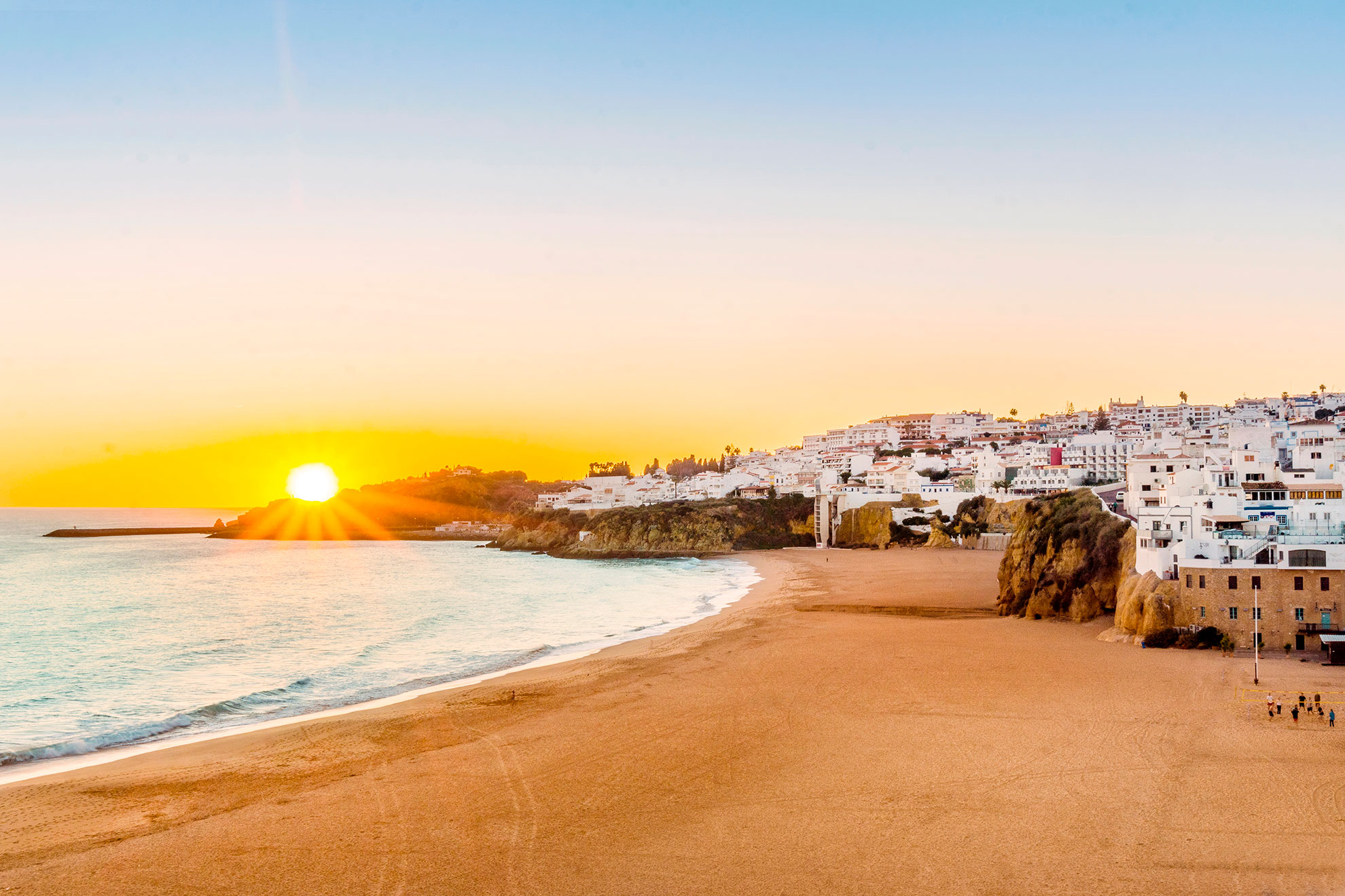 Sunset view over Albufeira, Algarve, Portugal — golden light on the town and sea