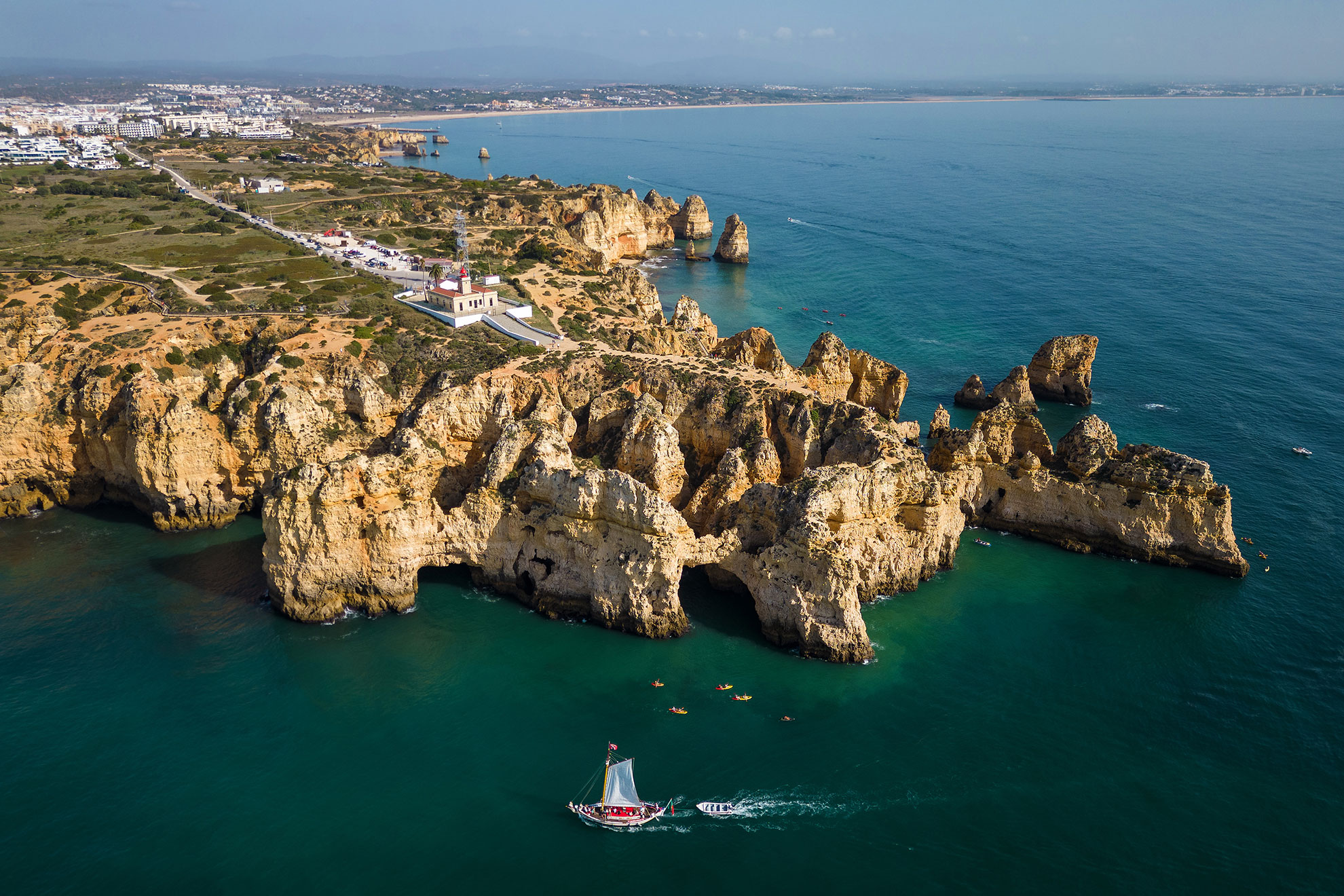 Aerial view of Ponta da Piedade golden cliffs and rock arches near Lagos, Algarve