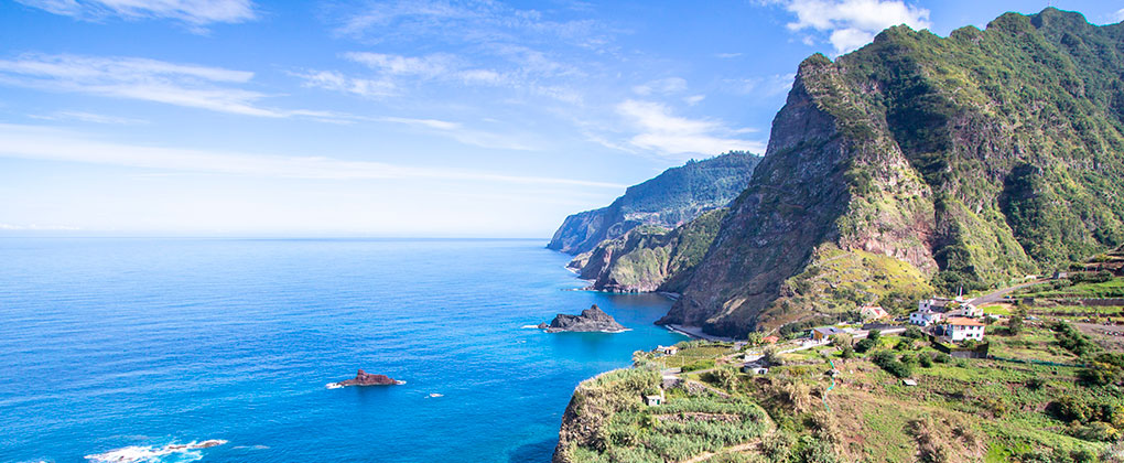 Panoramic view of Madeira Island's volcanic landscape and Atlantic coastline