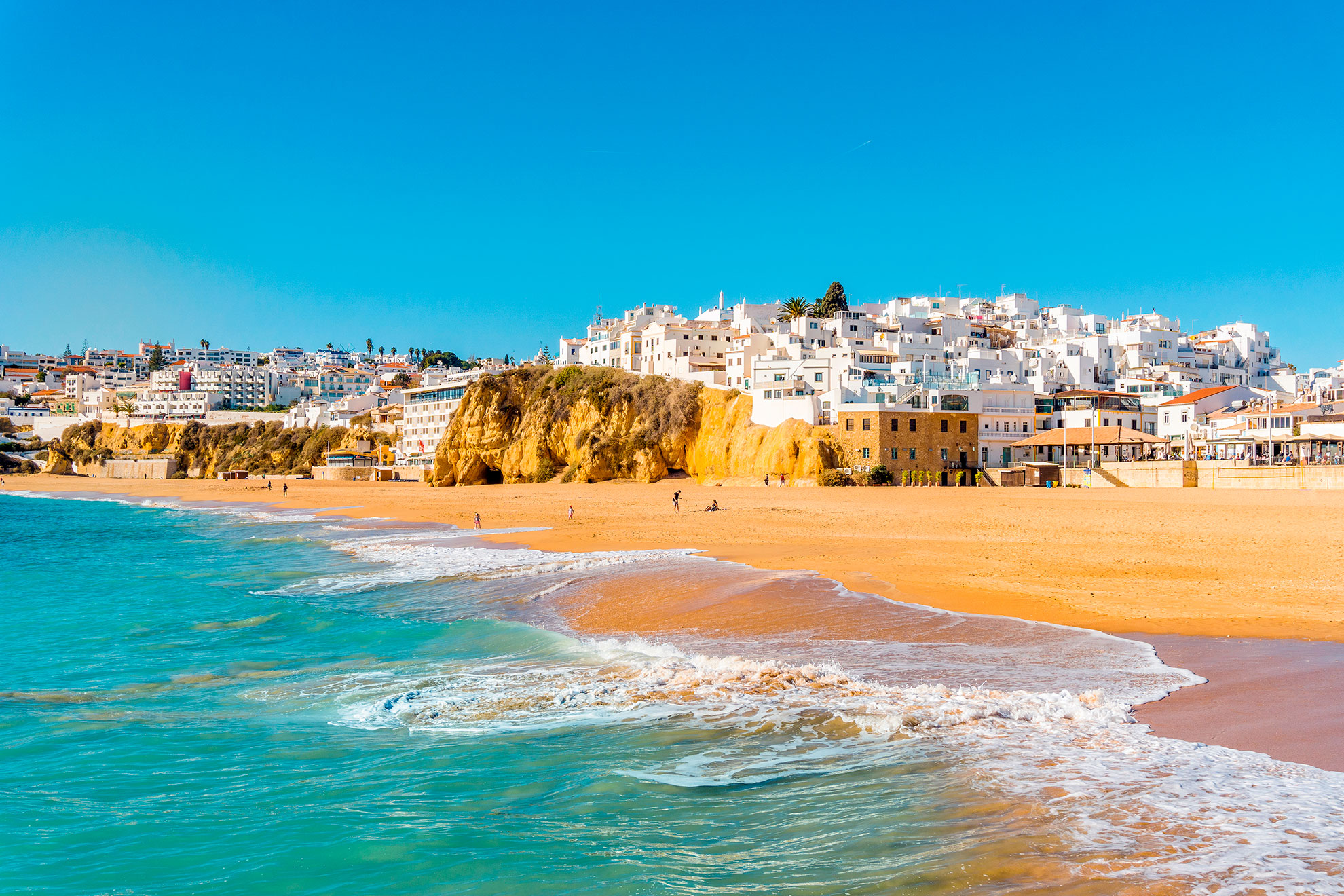 Aerial view of Albufeira's golden cliffs and turquoise Atlantic waters