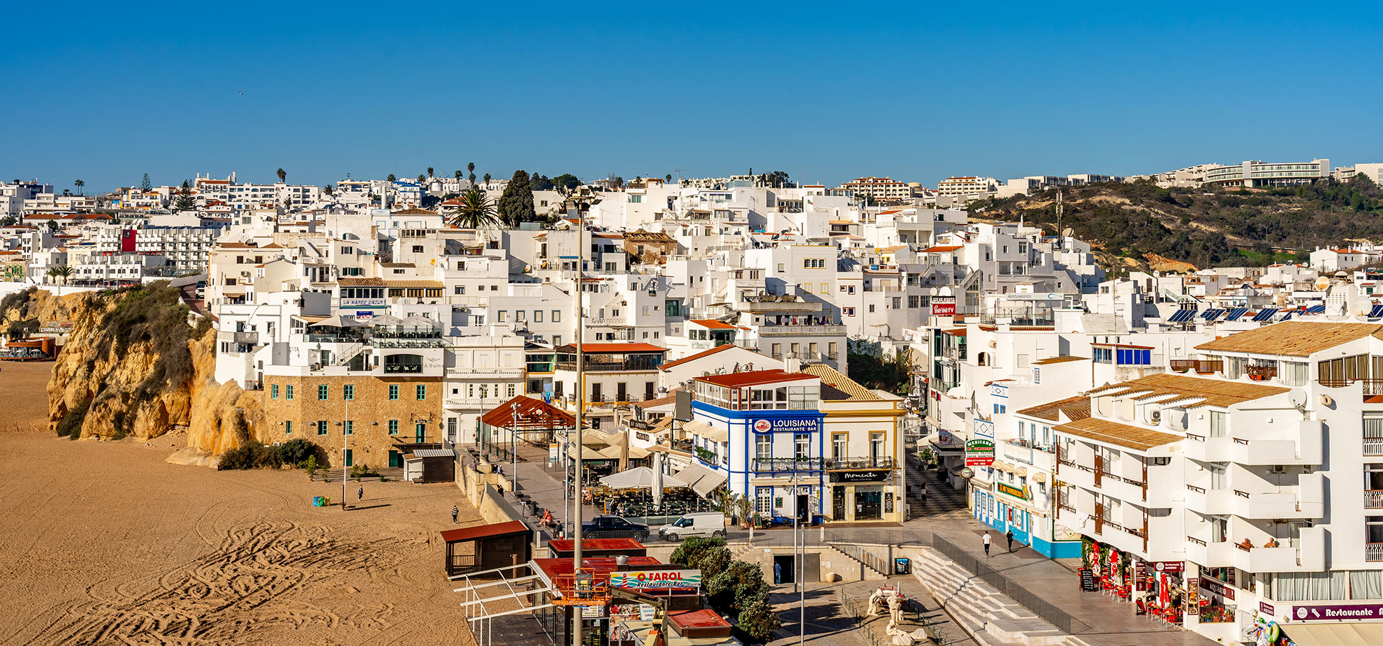 Narrow whitewashed streets in Albufeira's Old Town with traditional Portuguese tiles