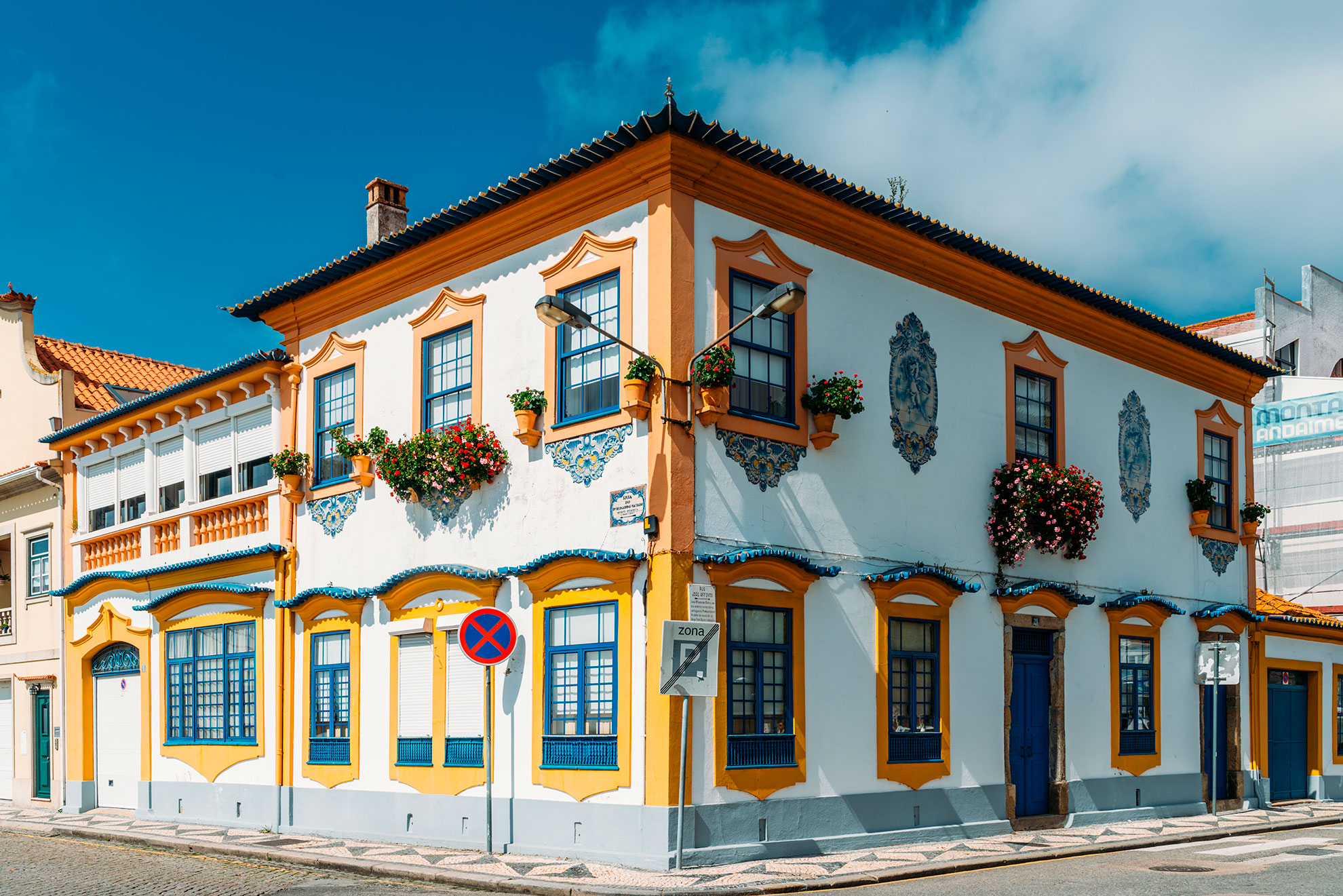 Art Nouveau building façade in Aveiro with geometric blue and white ceramic tiles