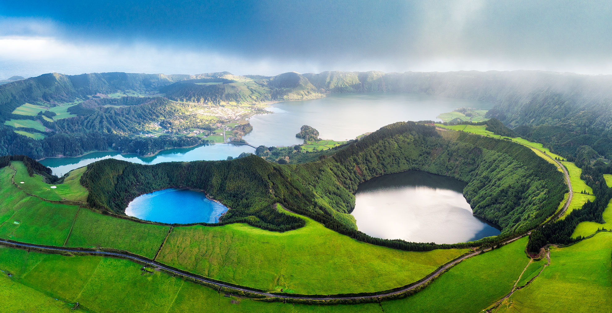 Aerial view of the emerald and cobalt twin lakes of Sete Cidades caldera, São Miguel, Azores