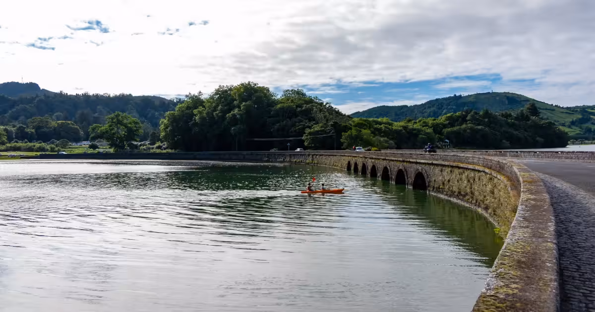 Kayaker paddling on Sete Cidades twin crater lakes in S&atilde;o Miguel Azores.