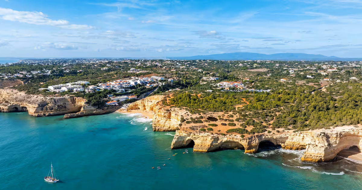 Limestone cliffs and sea arch above Benagil Cave on the Algarve coast.