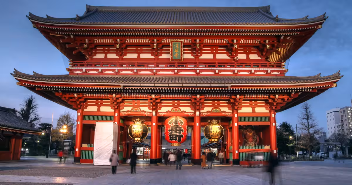 Senso-ji Temple in Asakusa, Tokyo, with traditional red lantern and crowds of visitors.