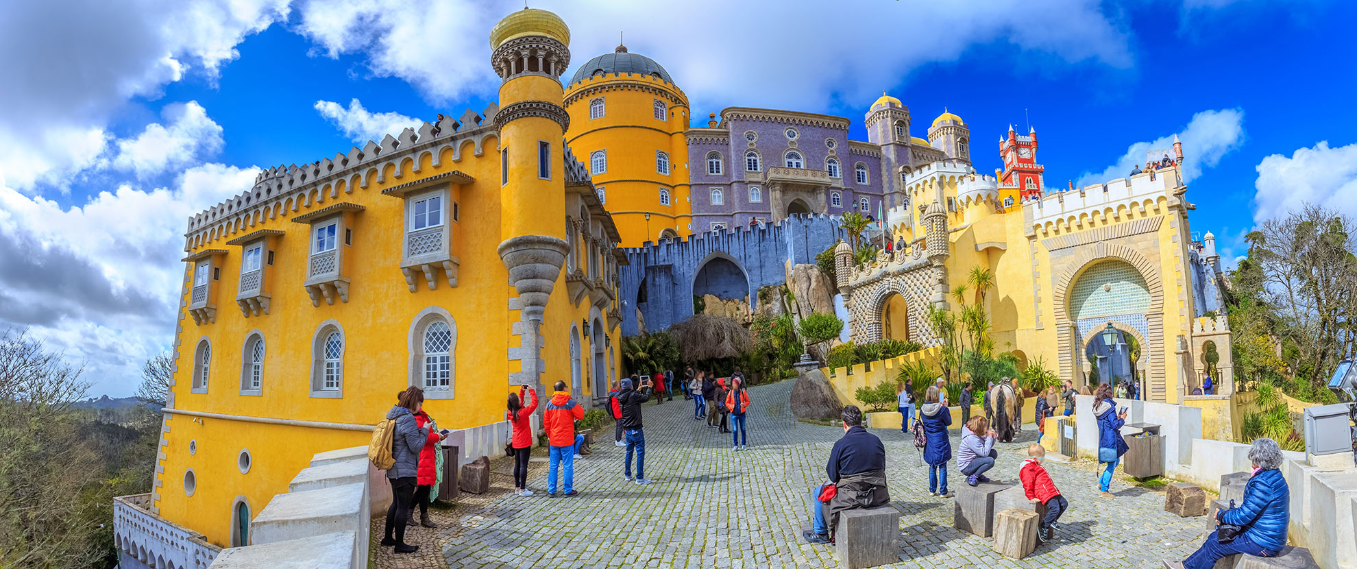 Empty Pena Palace Trit&atilde;o Gate terrace in early morning golden light.
