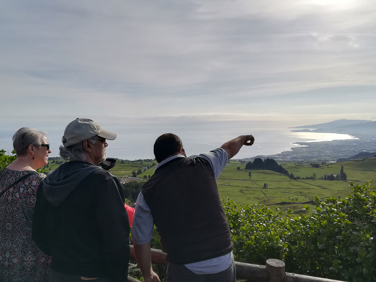 Tour guide explaining fumarole activity to visitors in Furnas Valley S&atilde;o Miguel Azores