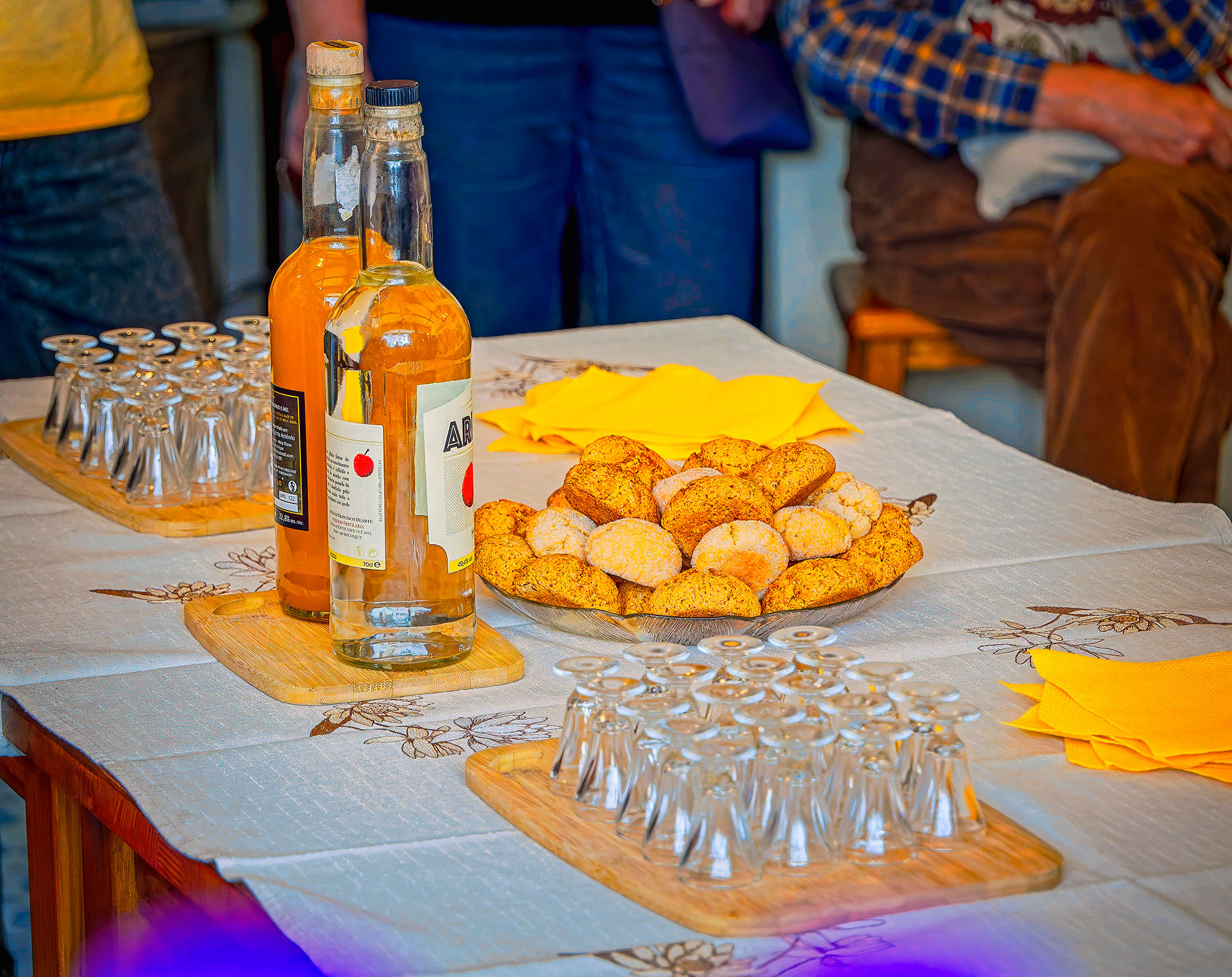 Local medronho spirit and honey served at a traditional Monchique farm table.