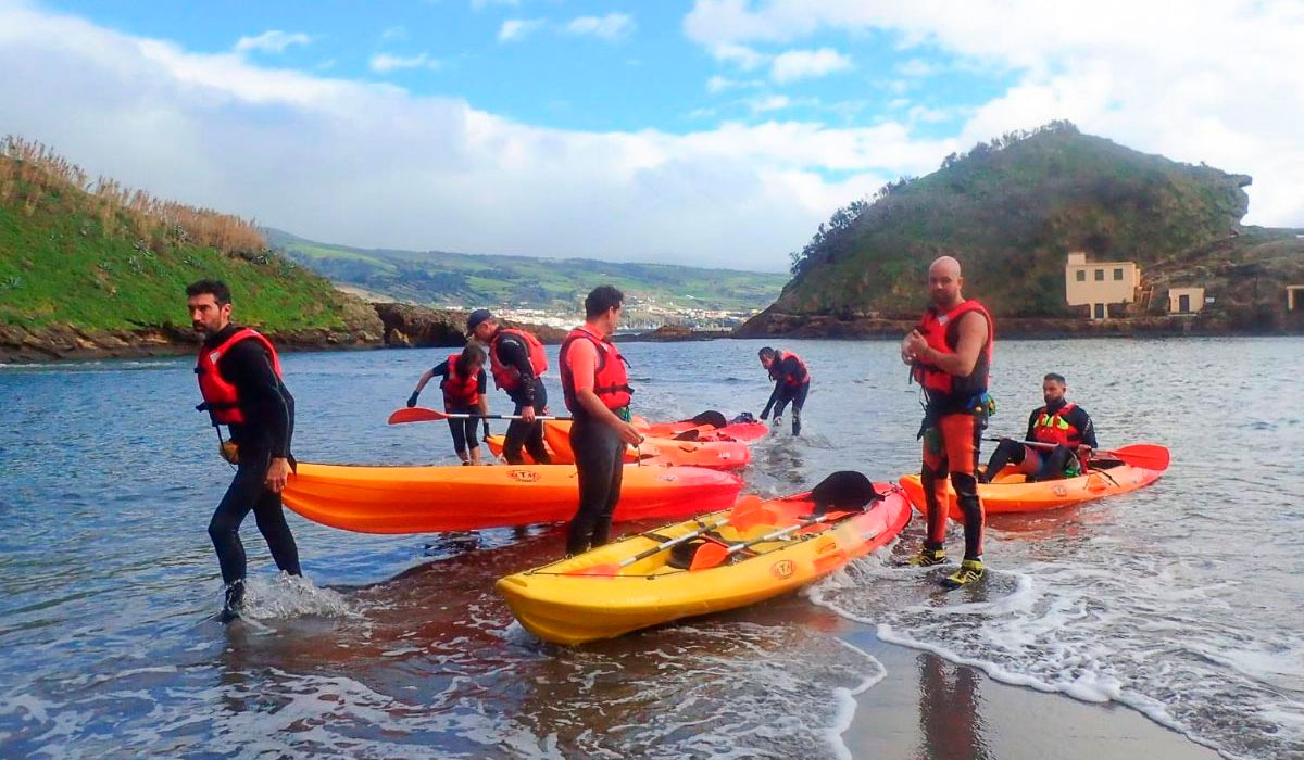 Kayaker inside the circular flooded crater of Vila Franca do Campo islet, Azores.
