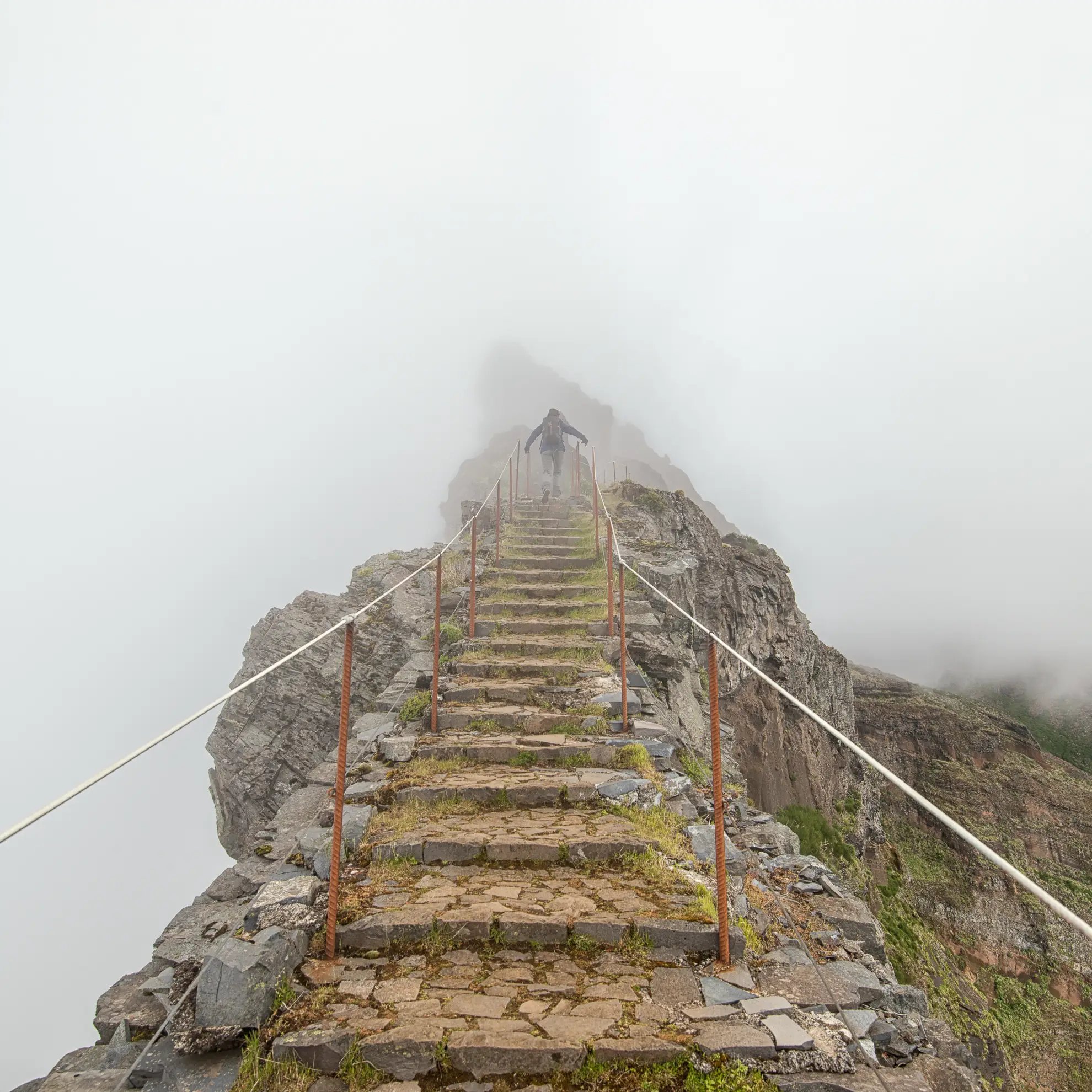 Exposed ridge trail between Pico do Arieiro and Pico Ruivo in Madeira's central massif.