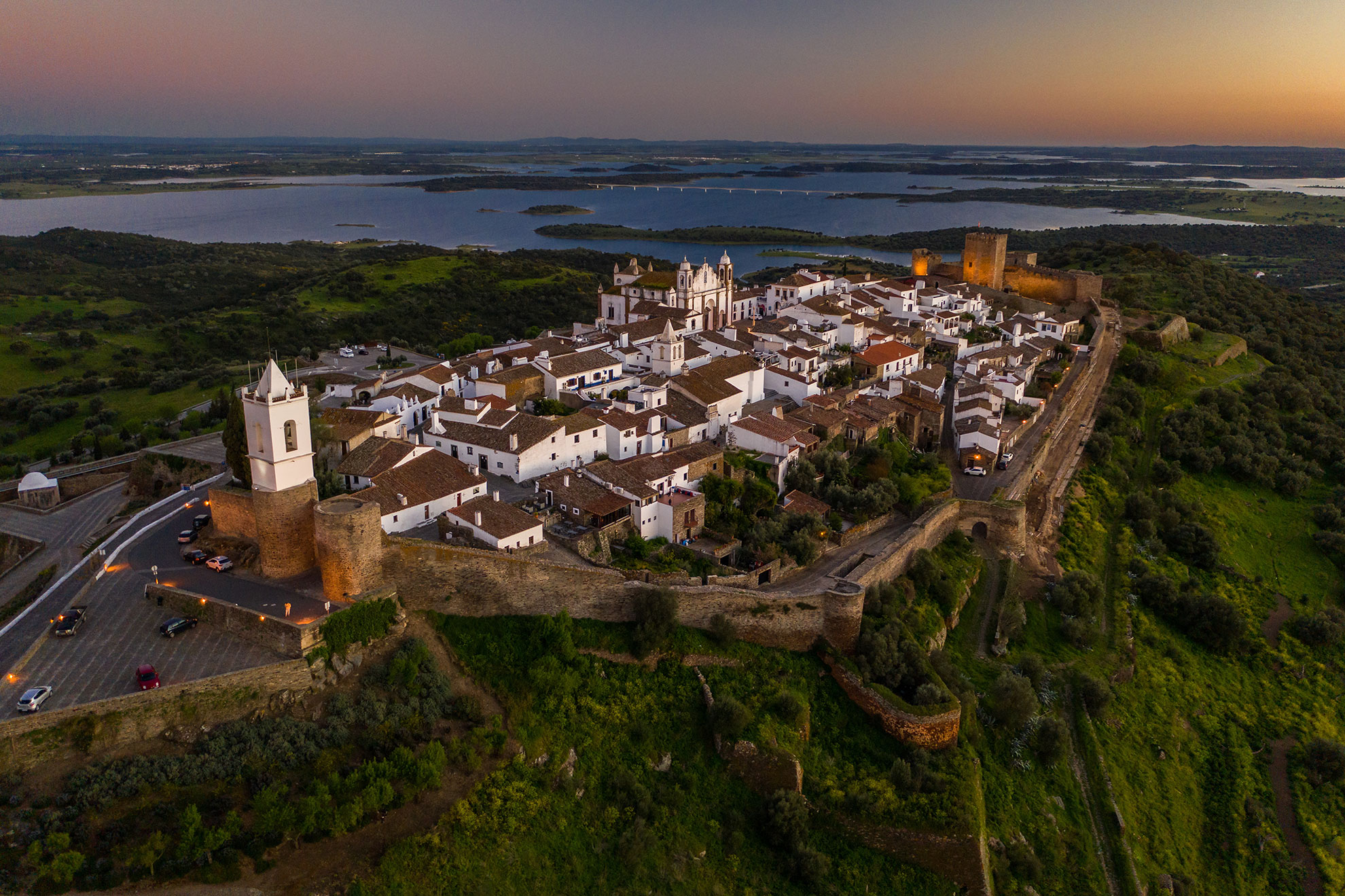 Monsaraz hilltop village at dusk above the Alqueva reservoir in Alentejo
