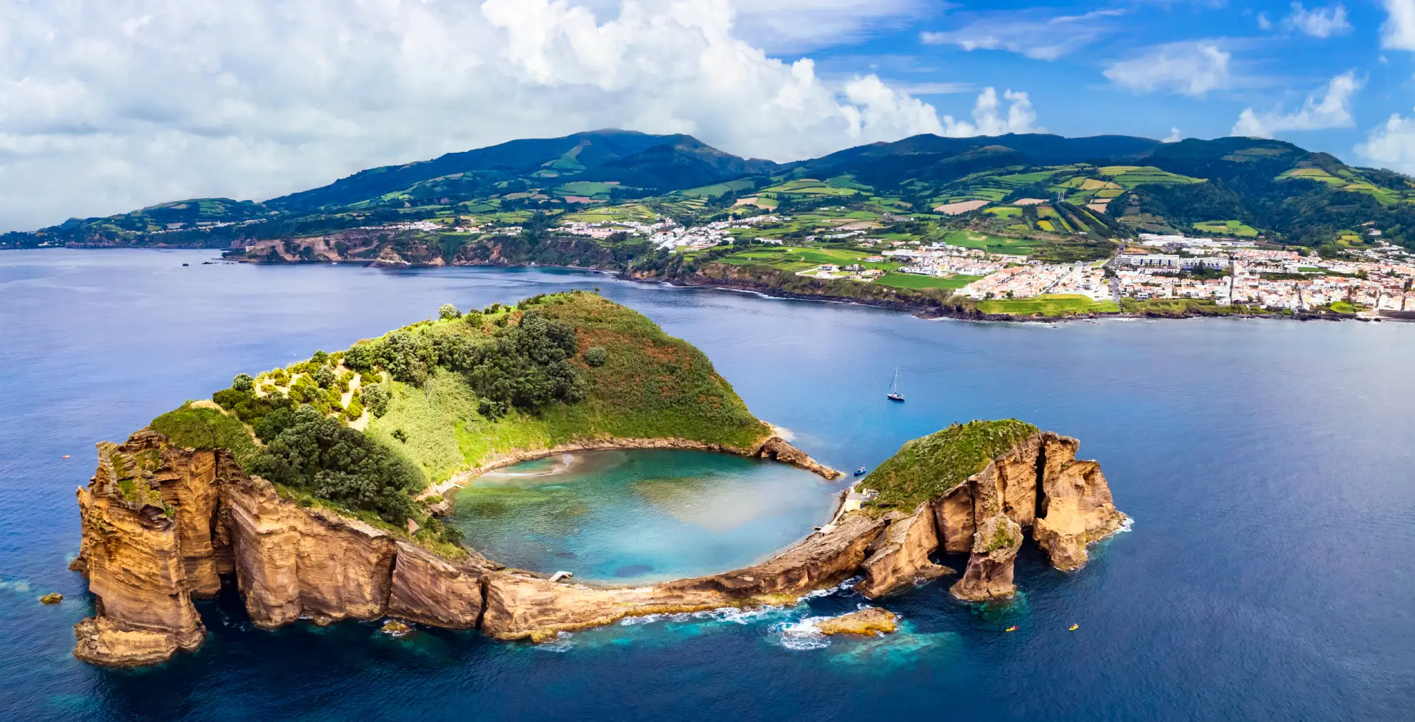 Aerial view of Vila Franca do Campo Islet circular volcanic lagoon from above