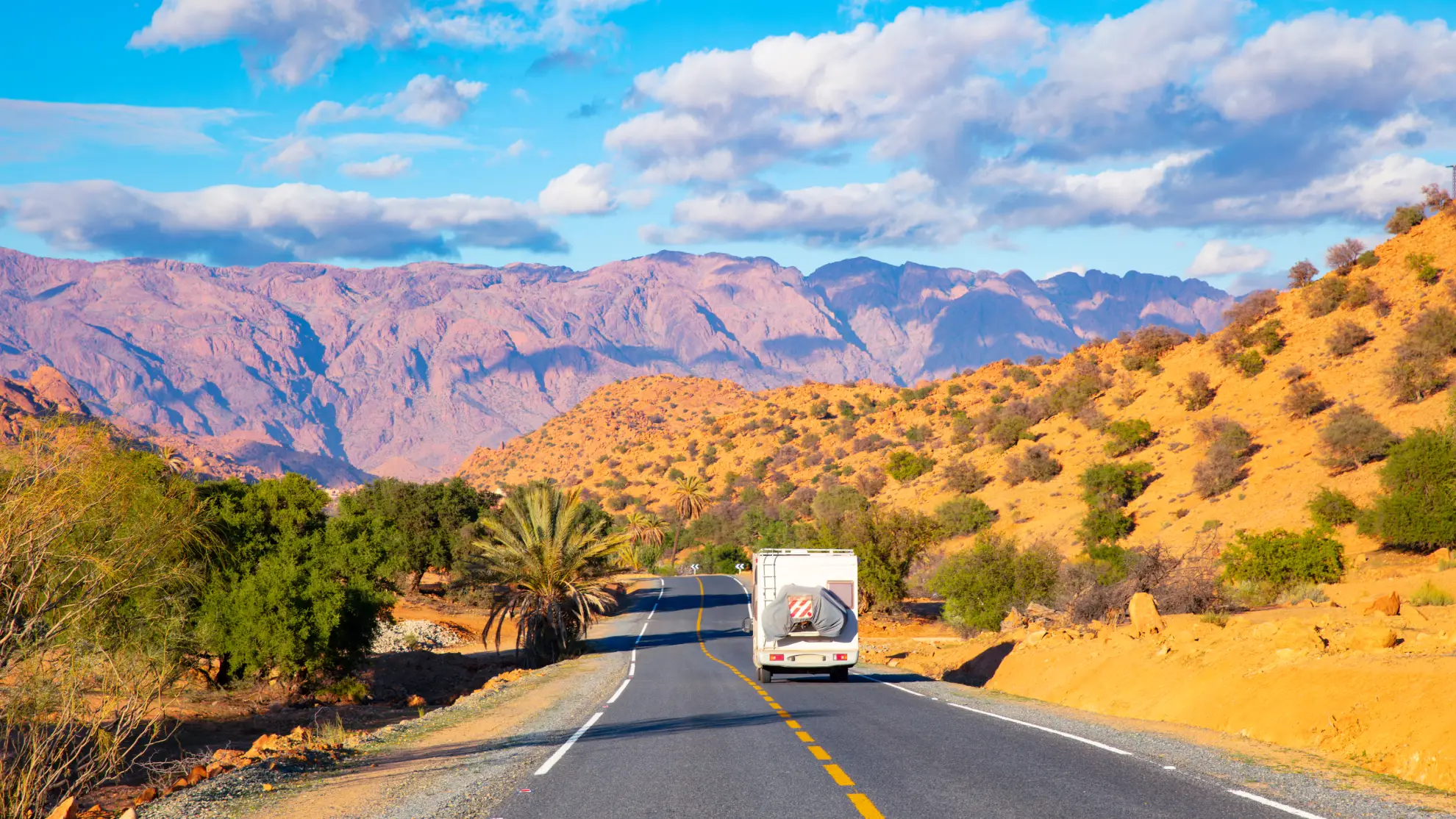 Mountain landscape along the road from Tangier toward interior Morocco, showing valleys and foothills.