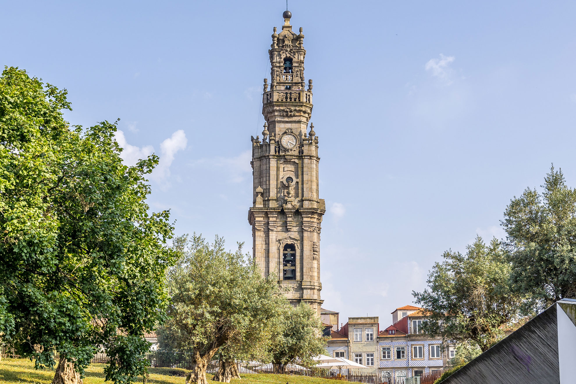 Baroque granite facade of Porto's Cl&eacute;rigos Tower viewed from below