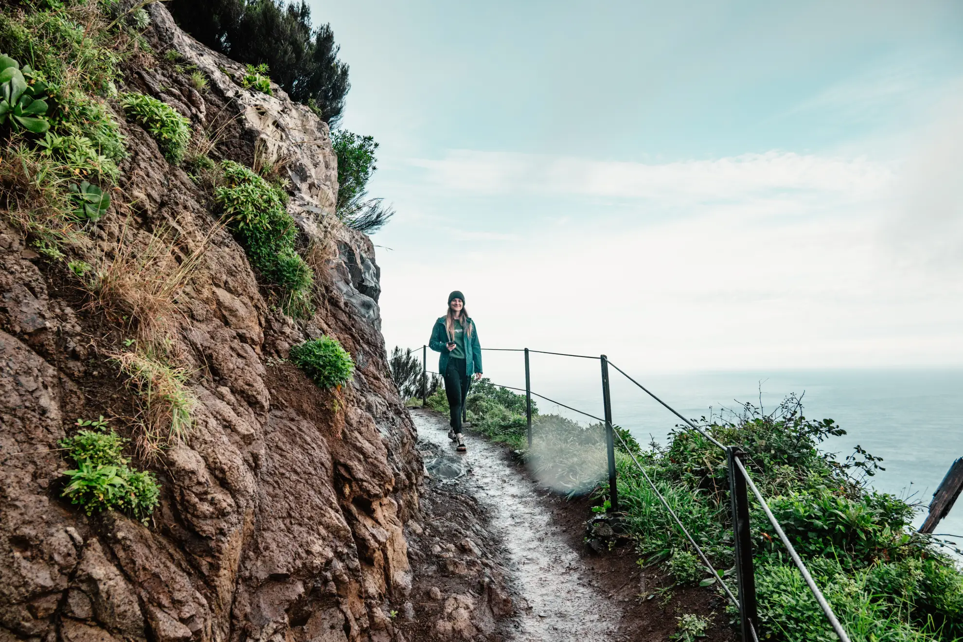 Narrow cliff trail of Vereda do Larano above the Atlantic in Madeira