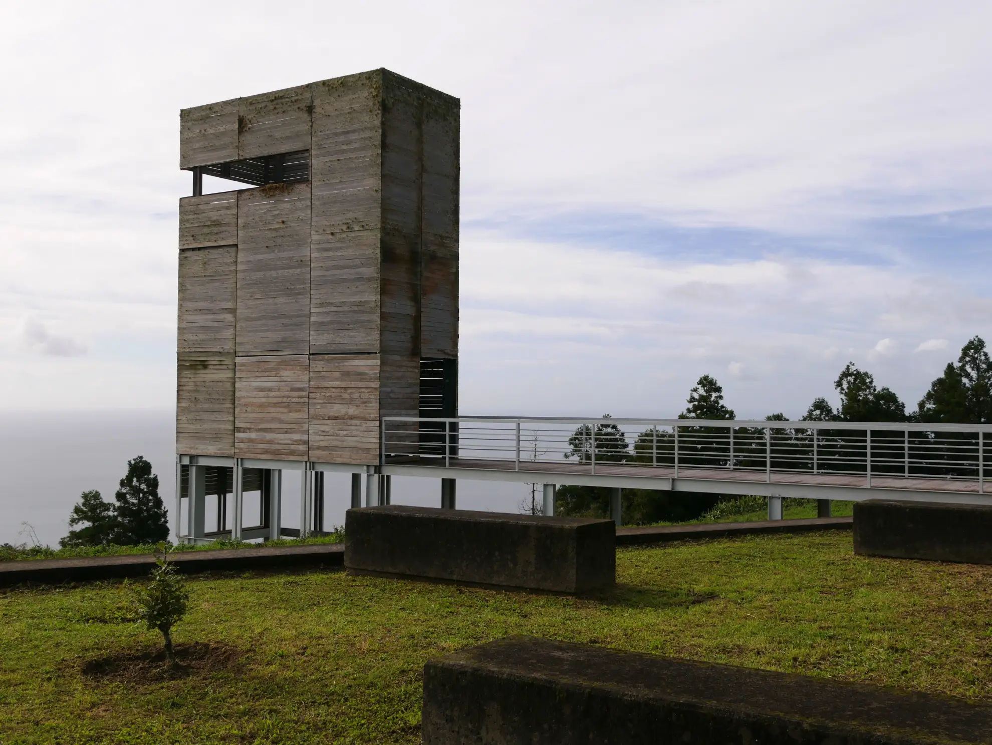 View through a historic vigia lookout hut window on Pico Island toward the sea
