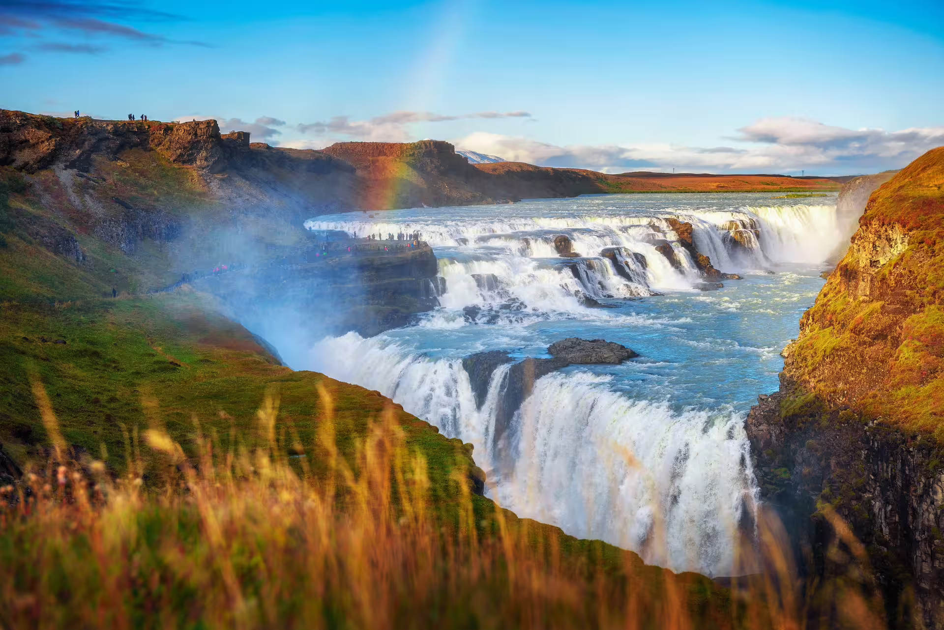 Private Golden Circle tour at midnight sun Iceland — Gullfoss waterfall and Geysir geothermal area in summer golden light